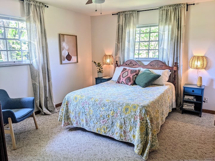 Main bedroom with queen bed and attached bathroom; spacious closet and dresser. 