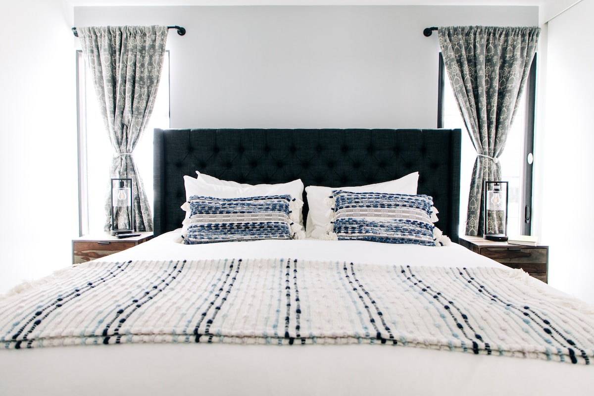Guest bedroom with King bed, wireless charging touch control lamps, black out curtains
