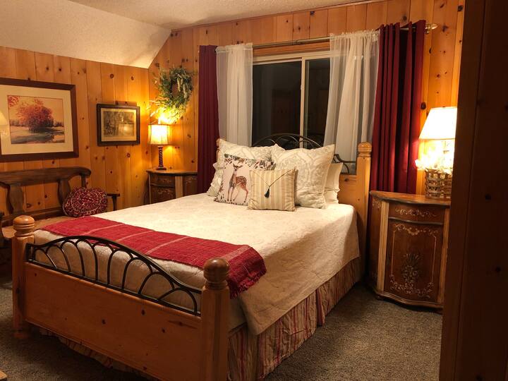 This bedroom is very cozy and sweet, closet for your luggage and hanging space, opens to the barn door bathroom where there is two kinks and a huge 2 person tub.