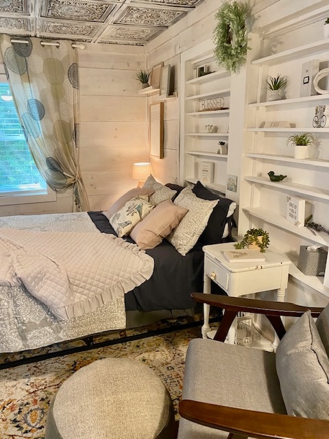 Queen bed in 2nd bedroom is connected to bathroom. It has a 32 inch tv, reading chair, closet for storage and window that looks out to the Crepe Myrtle trees in the side yard. 