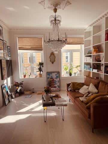 Artsy flat with chandeliers and fireplace