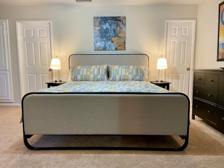 Masterbedroom with CA King size bed, on suite bathroom, walking closet, mirror closets, dresser and 37" tv 