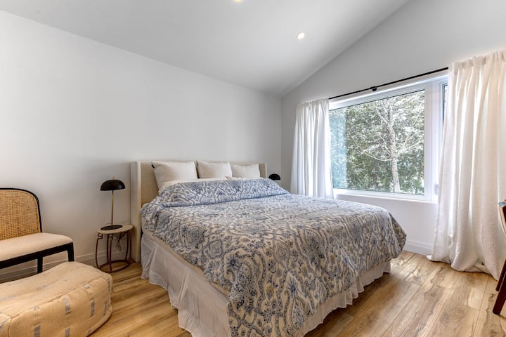 Master bedroom with work desk and chair. King size bed. Second floor with lake views.