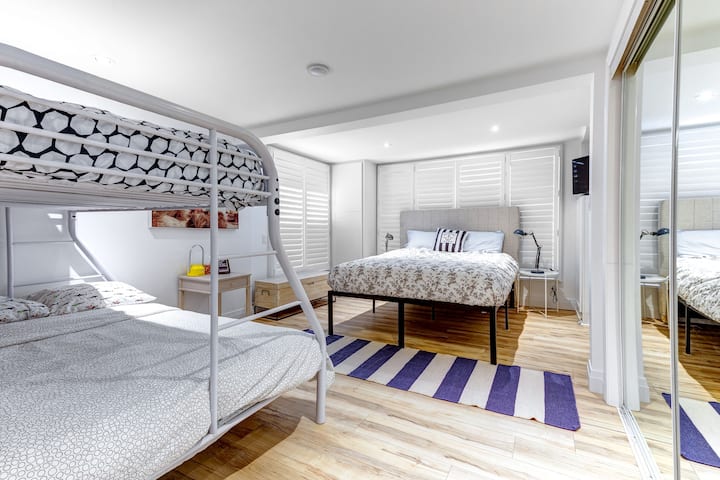 Guest wing, first floor, large family bedroom with ample storage space and smart tv. 