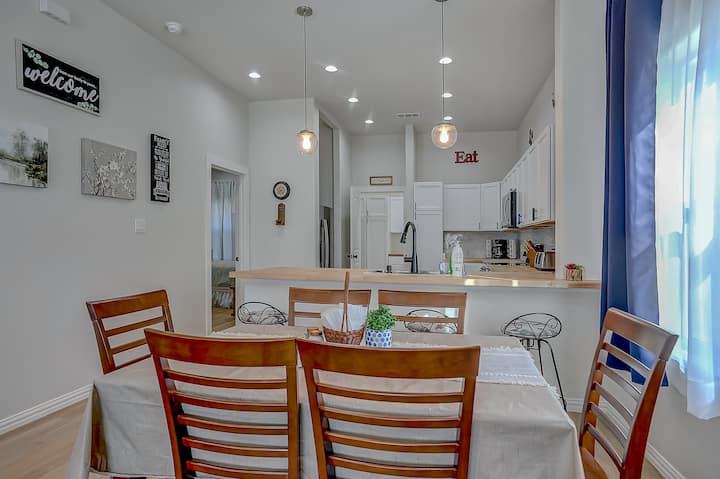 Everyone can enjoy hanging out close to the living room at the dining room table right next to the kitchen!
