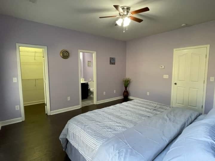 Ground floor 1st (master) bedroom- features a king bed, private bath, spacious walk-in closet and additional coat closet.