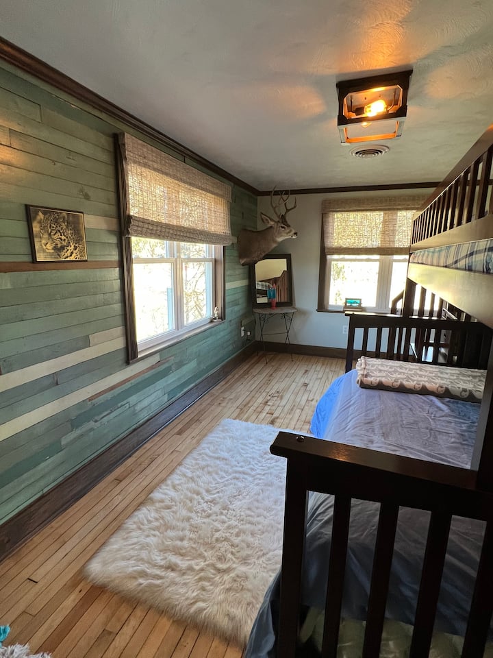 The third bedroom upstairs has bunk beds with 1 queen and 2 twin beds (a trundle on the bottom slides out).