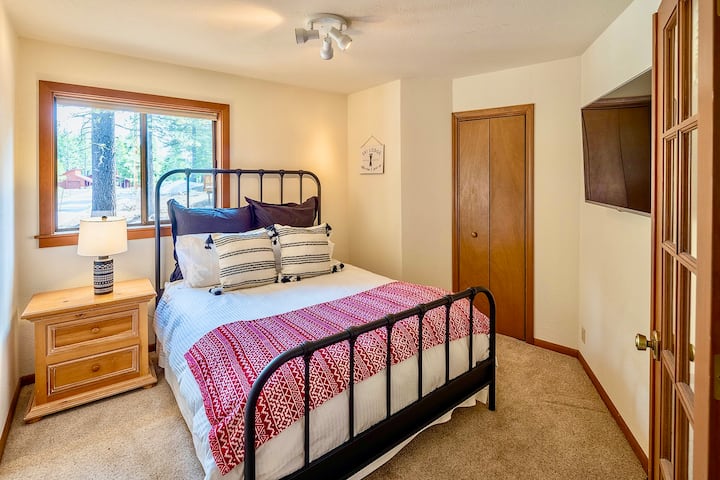 First main level bedroom with closet and TV.