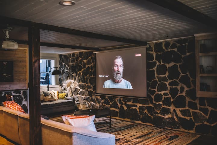 Home theater is equipped with oversized 110 inch screen with HD projector and speaker systems.
