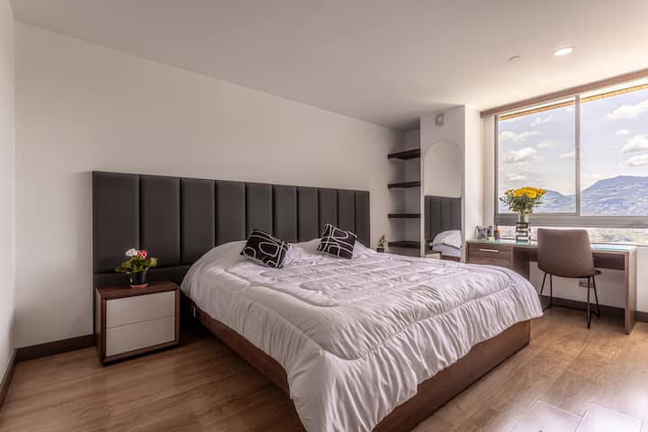 Master Bedroom: Blinds are operated with a cord. There is also a wall-mounted mirror, built-in shelving, dedicated workspace, and a smoke detector in this room.
