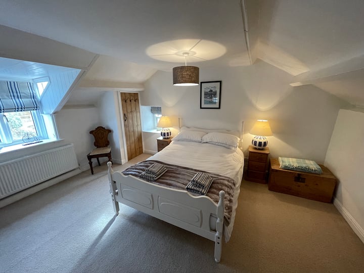 On the 2nd floor, there's a double bedroom with bedside tables, a large chest of drawers, bookshelves with loads of DVD's a TV, PlayStation and Wii.