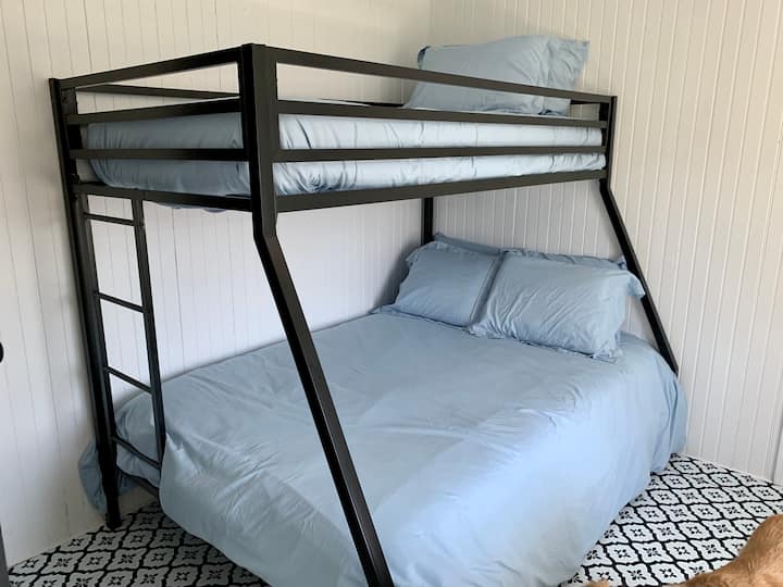 Brand new twin over full bunk bed in bedroom 4/with door to laundry.