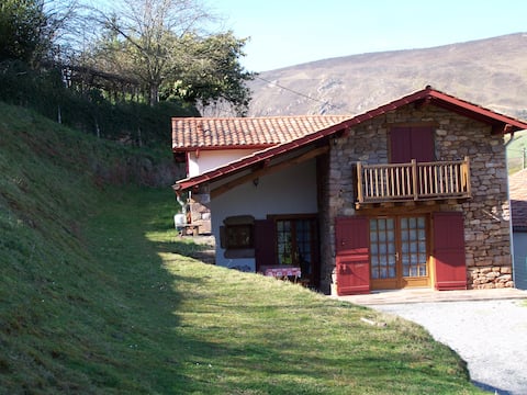 Old renovated sheepfold facing the mountains