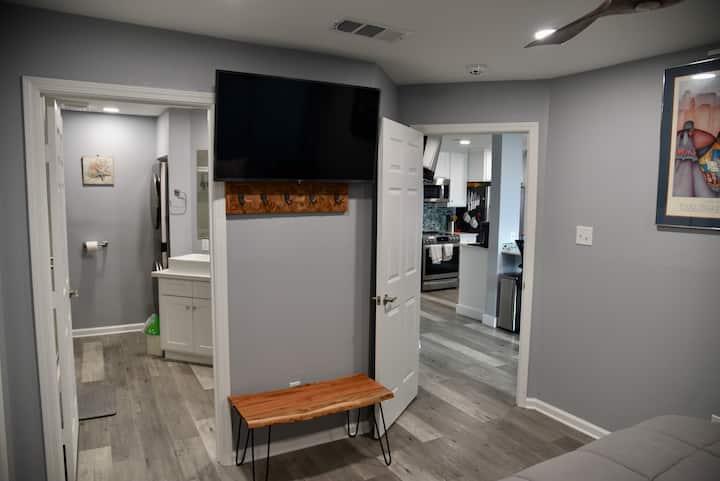 Owner's Suite view looking towards open kitchen and Owner's bathroom. 