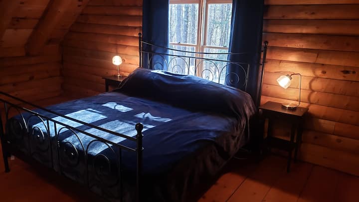 Master bedroom with a king bed, bedside lamps have usb chargers.   Armchair and floor lamp provide a perfect reading spot.  Large area to hang clothes.