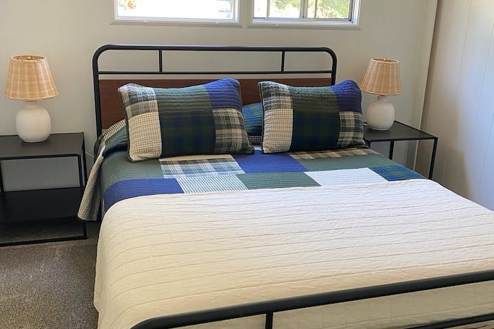 Bedroom #1 queen bed. Enjoy the comfort of this fully refreshed room, including: New bed, flooring, and linens.
