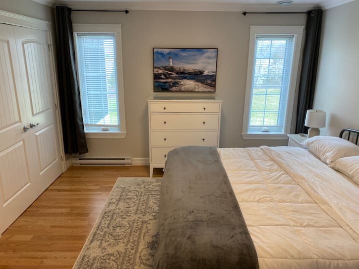 Spacious Master Bedroom has a King Bed, luxury linens and stunning lake views. 