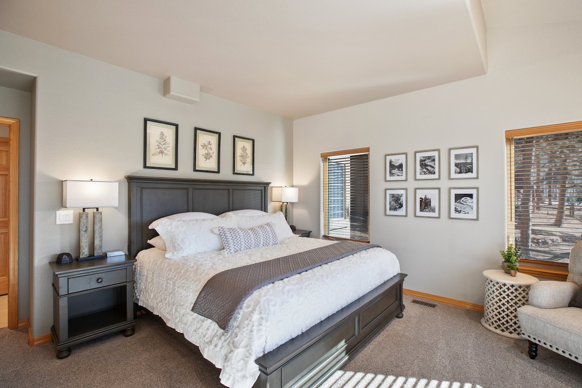 The primary bedroom on the main level with cozy king size bed.  Each night stand has smartphone charging pads and USB outlets for you personal devices. 