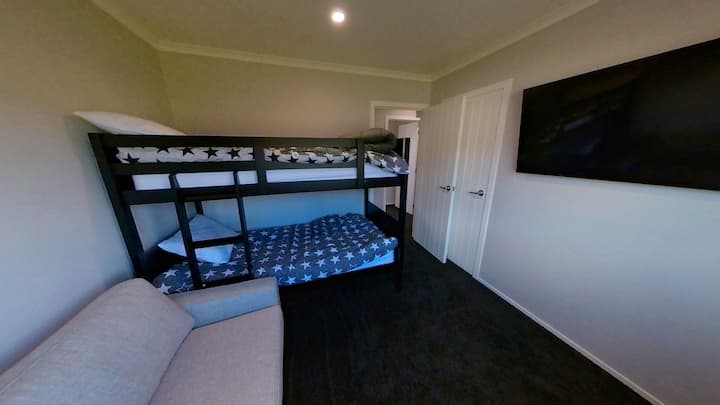House 2 - Bunk room with pull out sofa and 50" TV