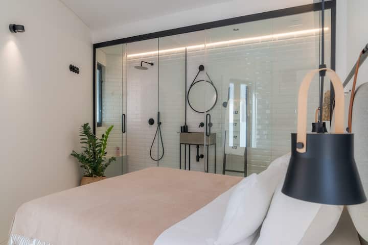 Bedroom 1 with queen bed size and Bathroom.