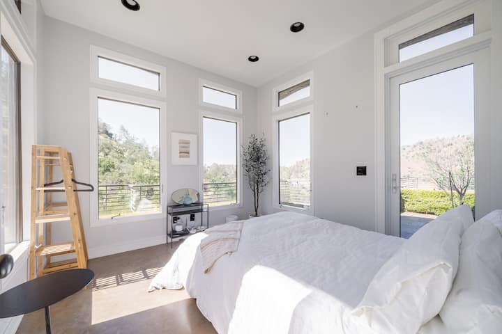 Bedroom on Main Level, with comfortable Queen Bed, Down Duvet, and 270 degree views.