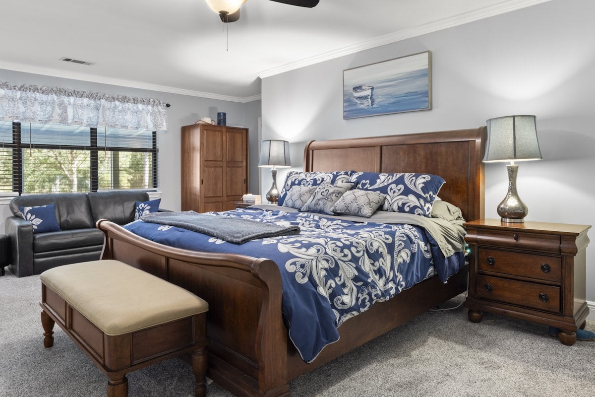 Primary Bedroom with attached Primary Bath and direct access to outdoor hot tub (couch no longer in room)
