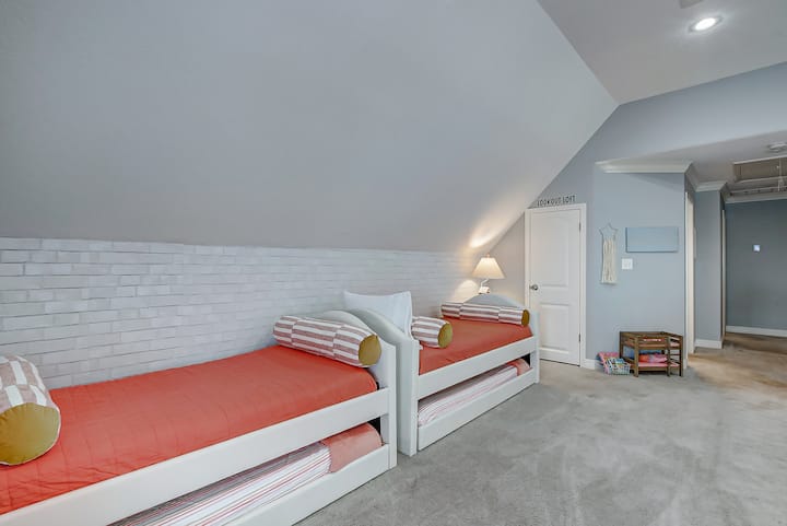 The Lookout Loft offers four twin-size beds - along with kids' toys and books. This room overlooks the downstairs living area.