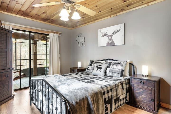 Moose-themed bedroom with adjoining moose-themed bathroom.