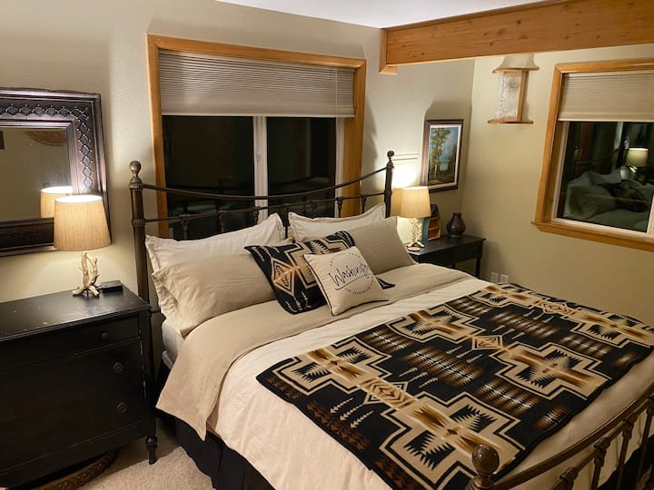 King bedroom downstairs with cozy finishes