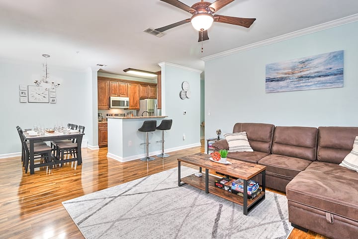 Experience ultimate comfort in the living room with a sofa, TV, TV cabinet, ceiling fan, and a lamp