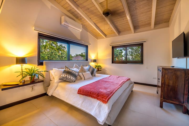Bedroom #1 (KING) with attached en suite bathroom with outdoor shower