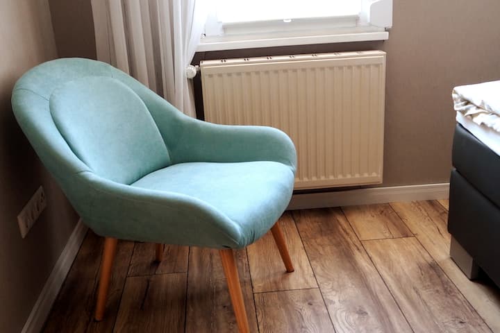 Kolltuku i rehatshëm në dhomën e gjumit