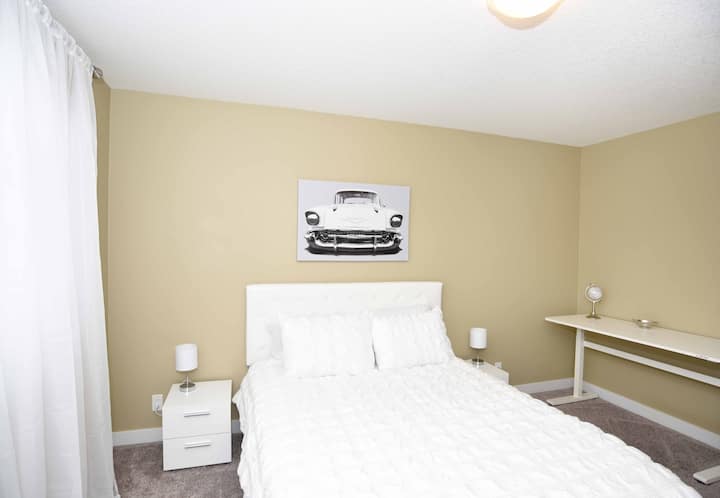 Primary Bedroom with Queen Bed and workspace