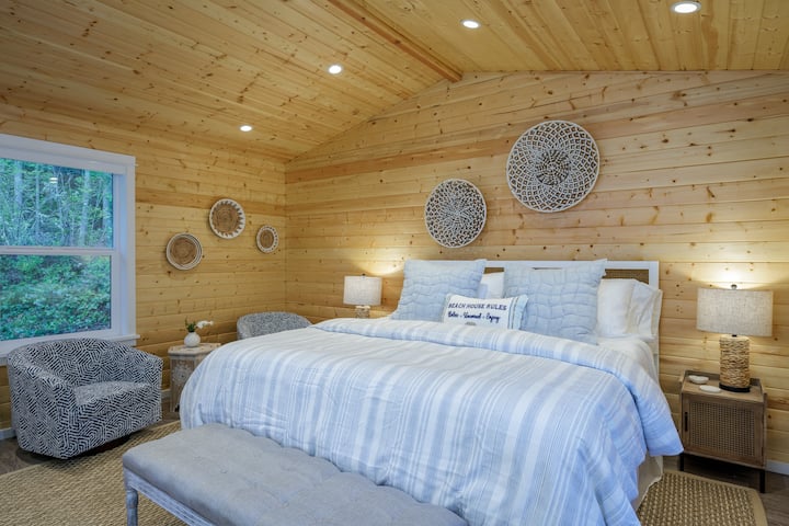 The spacious bathroom features high ceilings, soft bathrobes, and a 14-inch memory-foam king sized mattress! Relax here after a long day of swimming hiking!