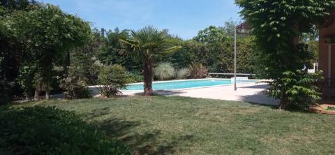 Family villa with swimming pool and enclosed garden with trees