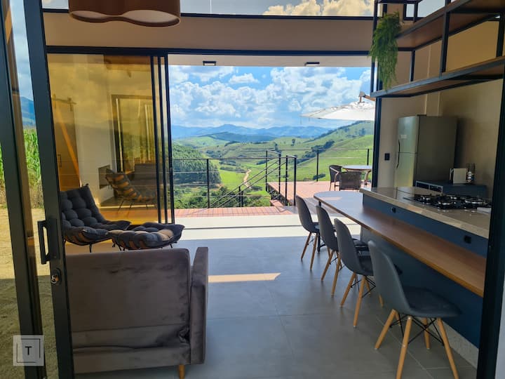 Wide glass doors, connecting the interior to nature