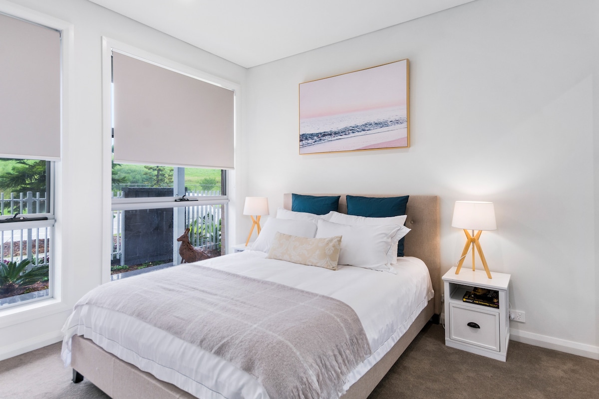 The light-filled second bedroom, located on the ground floor, features a queen-size bed. 