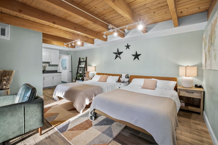 Bedroom #4 - Downstairs bedroom with 2 queen beds (Zinus memory foam). 3 nightstands, ample outlets. HomePod Mini, and humidifier. And that pop of Northstar with the tri-star wall decoration. 