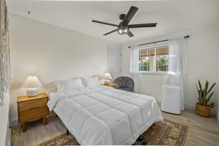 Bedroom #1 - Queen bed (zinus memory foam), two nightstands with lamps, additional outlets on the right nightstand, luggage rack, additional fan, humidifier and lounge chair