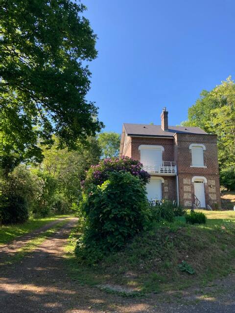 Quiet brick house at the edge of the woods