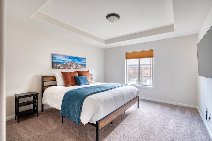 [Master Bedroom] Comfortably sleeps two adults on a king size mattress, another large Roku flat screen streaming TV, walk-in closet and private access to the master bathroom. Includes nightstands with lamps, comforter and two blankets to stay cozy!