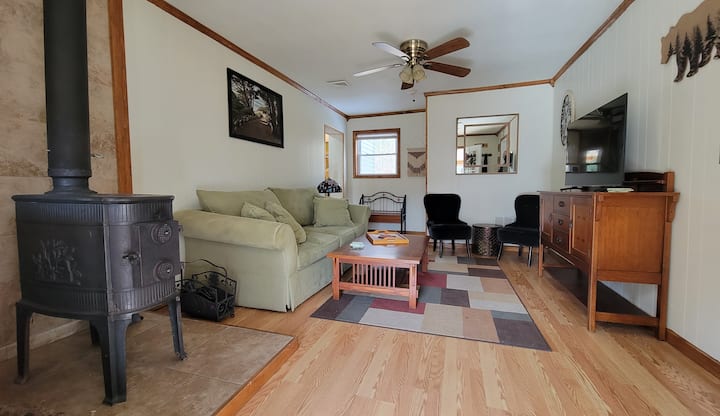 Living Room with queen sofa bed and Samsung Smart tv.