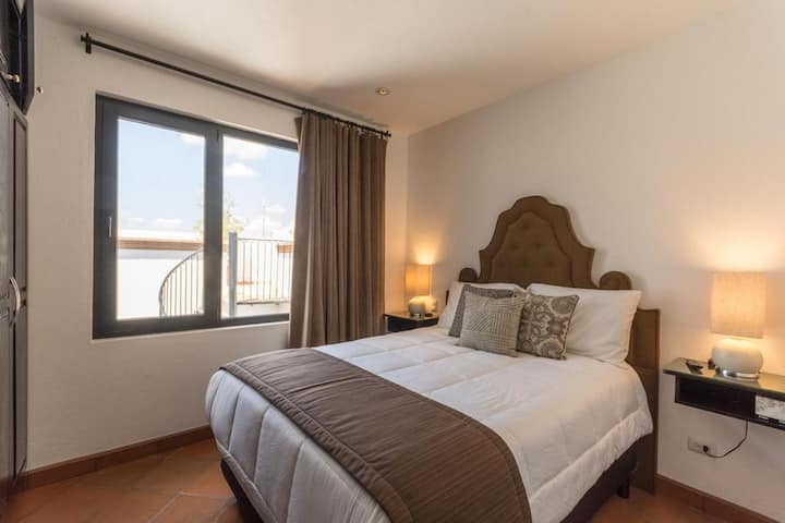 Upstairs Bedroom #4: This guest bedroom features a premium Queen bed with private bathroom, safe box, large closet, AC/heat unit, soundproof window, and flat screen TV.