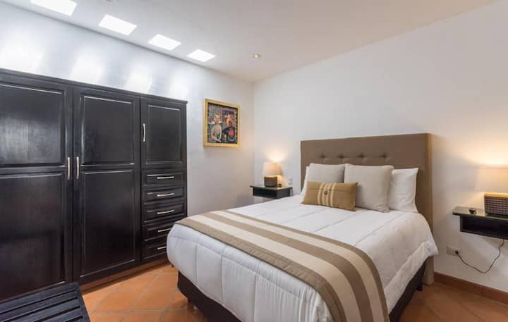 Upstairs bedroom #5: The 5th and final bedroom offers a high quality Queen bed with private bathroom, safe box, large closet with plenty of storage, flat screen TV, AC/heat unit, soundproof window and skylight.