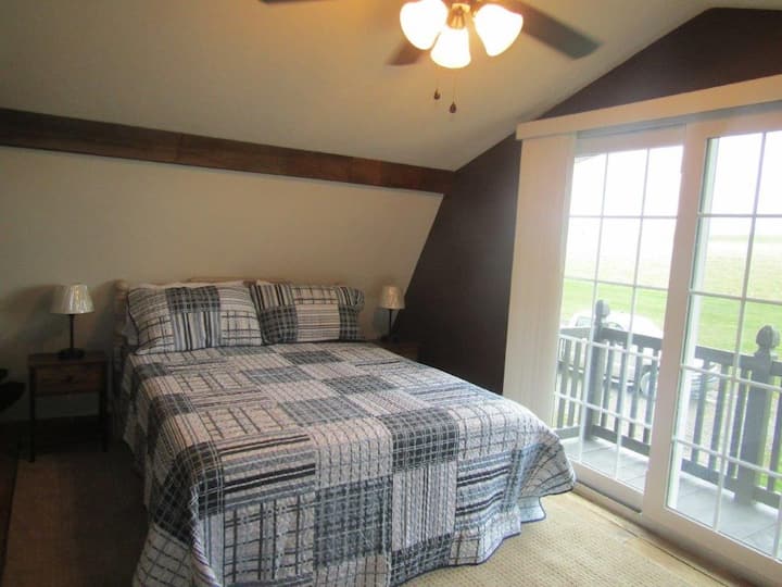 The queen bed in the loft has a hybrid mattress that provides firm and soft comfort. The side lights have outlets and USB ports for cell phone charging. And the view from the balcony is hard to beat.