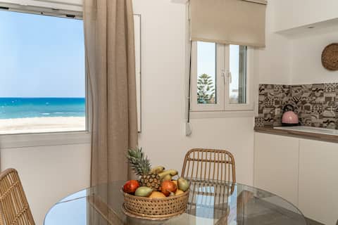 Feel the Aegean vibe at this beachfront boho condo