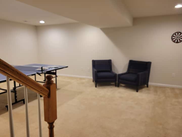 Basement is equipped  with ping pong table and a blow bed if  you require a third bedroom with a lock for Privacy.