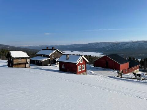 Cozy log living room at Hovde farm in Skurdalen