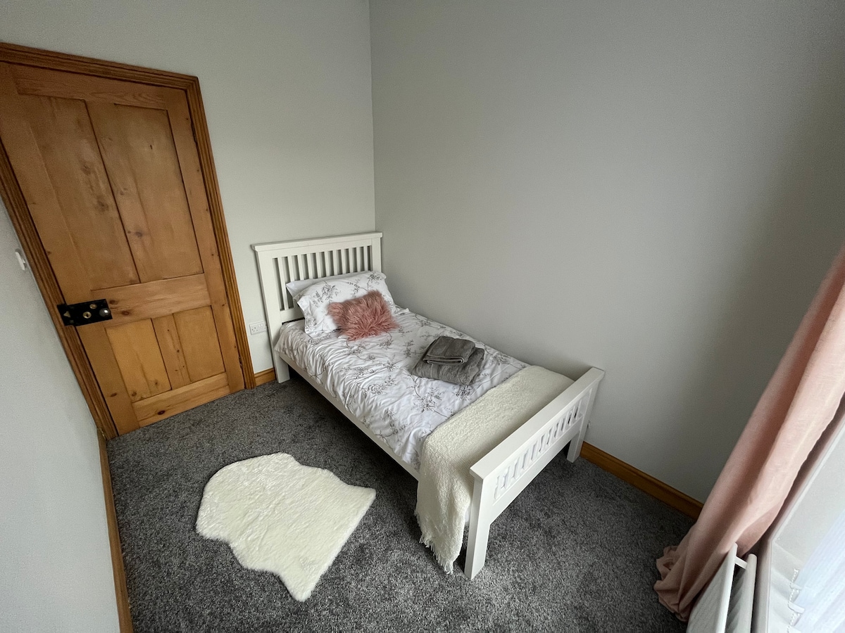 The single room at the rear of the property