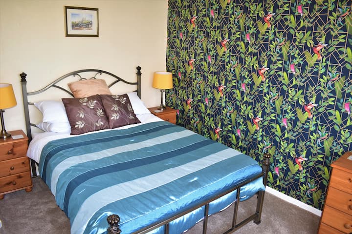 Double Bedroom - With bedside cabinets, chest of draws, wardrobe and Tv.
